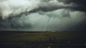 A tornado touches down in the middle of a field