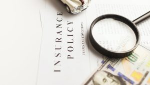 Insurance policy document with a magnifying glass