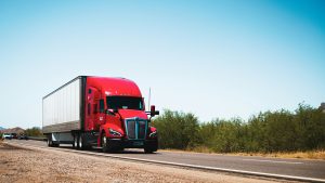 A semitruck driving on a road