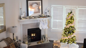 Christmas tree in home by fireplace