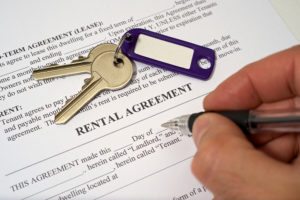 Keys on top of a rental agreement