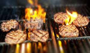 Hamburgers cooking on a grill