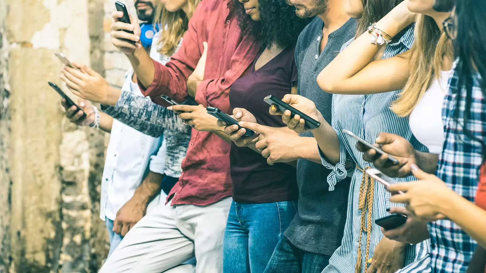 Group of people on their mobile phones