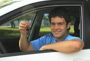 Man in car holding keys