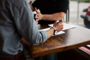 Reviewing documents on a wooden table