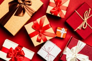 assortment of wrapped holiday gifts