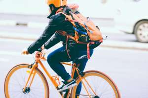 Woman riding a yellow bicycle