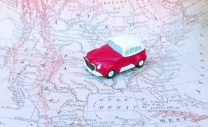 Small toy car on a map of North America