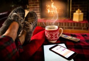 Relaxing in front of fire with coffee