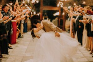 Married couple kissing on wedding day